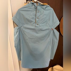 Gently used Poler reversible poncho. Light blue/mustard yellow. One Size.